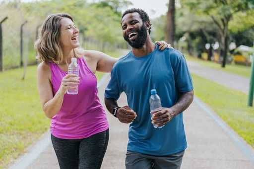 PHOTO Summer Safety Couple jogging w water bottles